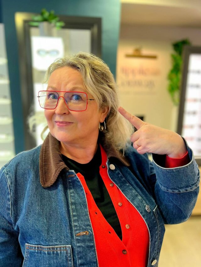 Woman pointing to her new glasses
